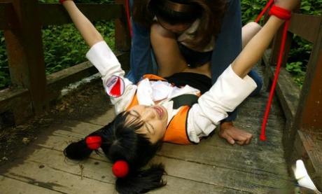 Submissive asian babe gets bound and roughly fucked outdoor