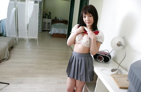Adorable asian teen Satsuki Ejiri undressing and showcasing her pink pussy