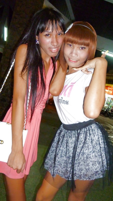 Skinny Asian tranny Jess posing outdoors in a skirt and high heels