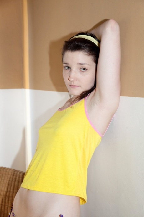 Sexy amateur teen Miranda Painter posing in her sexy panties & yellow shirt