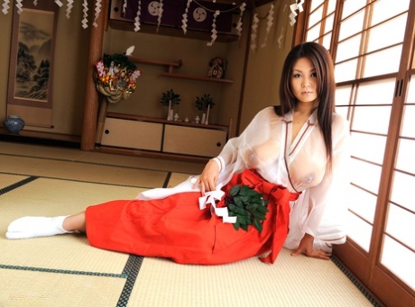 Braless Japanese bombshell Airi Ai uses her monster natural tits to wank a rod