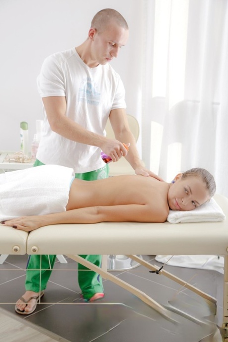 Brunette teen Carre gets a massage before riding a masseur's cock