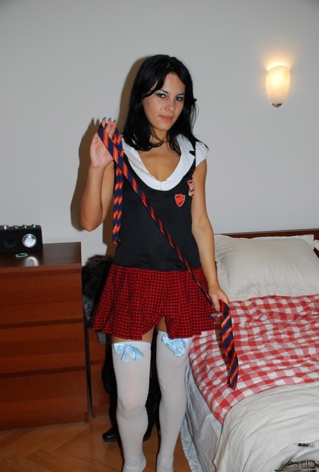 Slutty sexy teen Amabella posing in schoolgirl uniform before masturbation