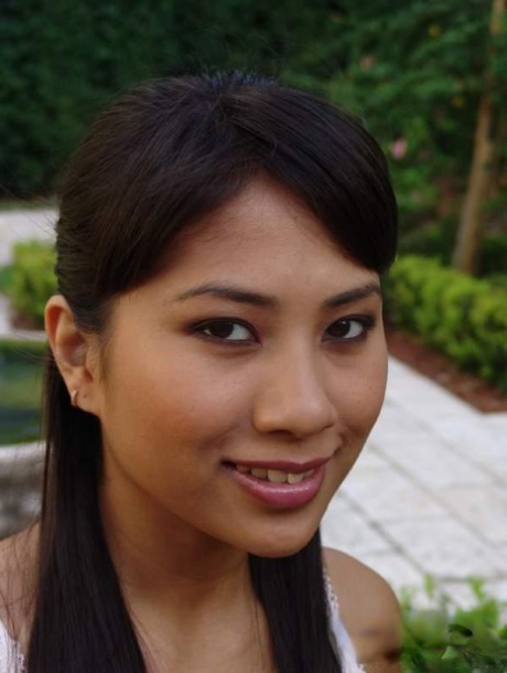 Lovely Asian chick Nyomi Marcela gives nice handjob and boobjob outdoors