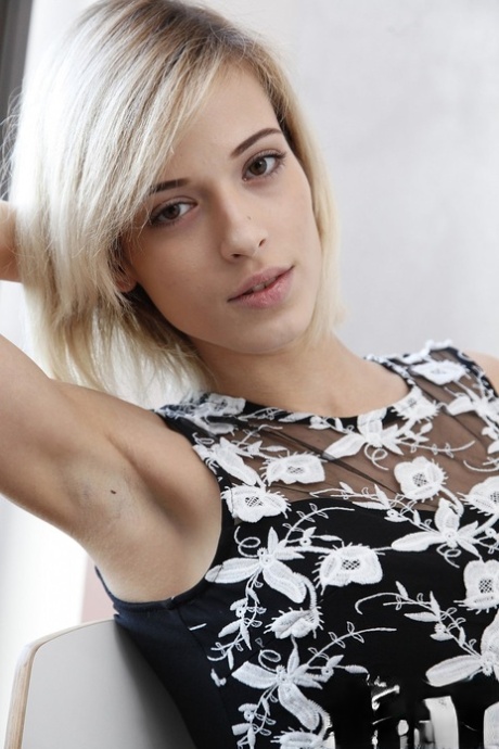 Slender pale blonde Ria Sunn gets naked to spread her petite ass