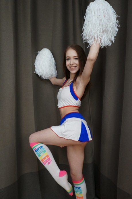 Teenage cheerleader Nata Ocean on all fours showing her tight booty