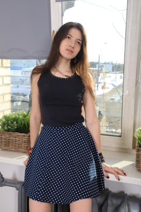 Skinny teen Camille drops her skirt and undies and plays with a sex toy