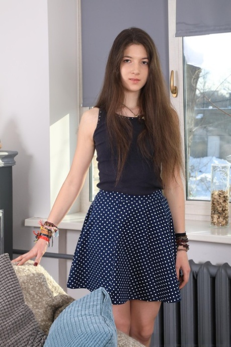 Skinny teen Camille drops her skirt and undies and plays with a sex toy