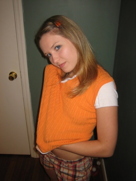 Skinny babe Kitty shows off her sweet teen tits & fingers her shaved pussy