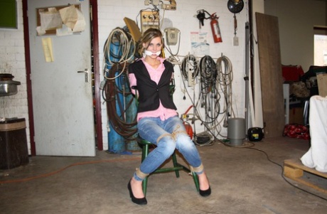 Skinny amateur blonde Irena posing bound to a chair in the basement