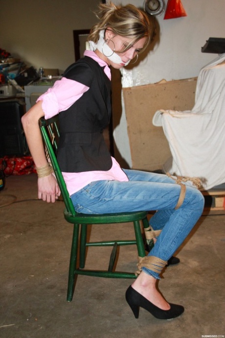 Skinny amateur blonde Irena posing bound to a chair in the basement