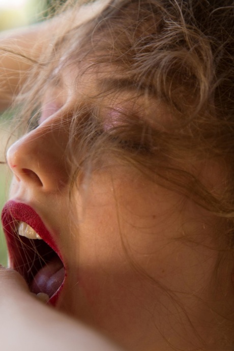 Glamorous teen with red lips Clarice shamelessly poses nude on the terrace