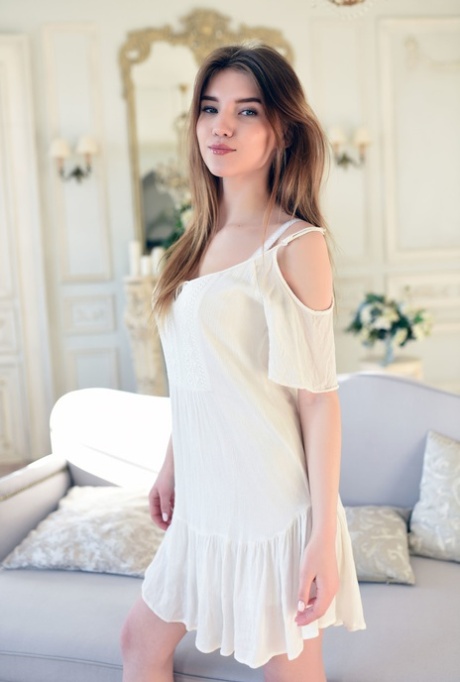 Skinny beauty Caramel doffs her white dress and flaunts her boobs