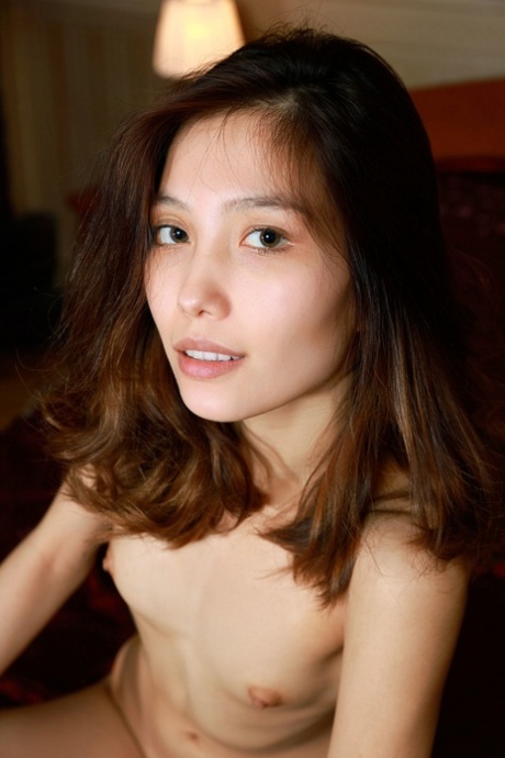 American beauty Anna Aki shows every inch of her sexy body as she strips