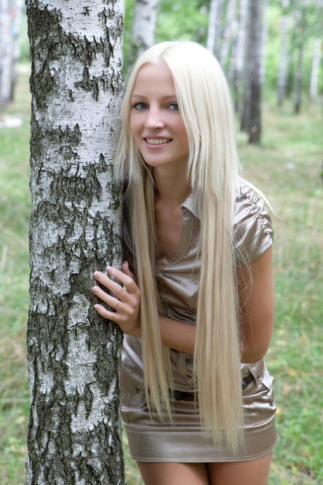 Beautiful teen Alysha A strips naked after giving a pantyless upskirt outdoors