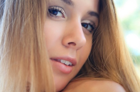 Cute Estonian teen Lina Diamond unveiling her small tits, pussy & feet outside