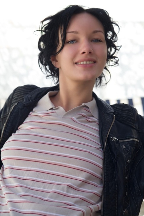 Glamorous brunette Loreen A undressing and posing naked outdoors