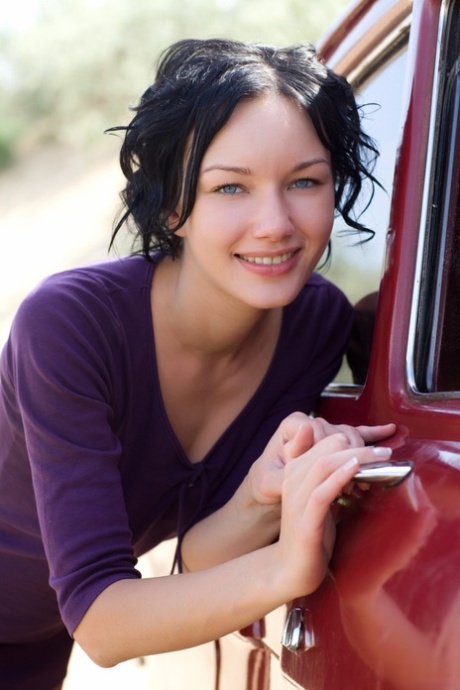 Glamorous brunette Loreen A undressing and posing naked outdoors