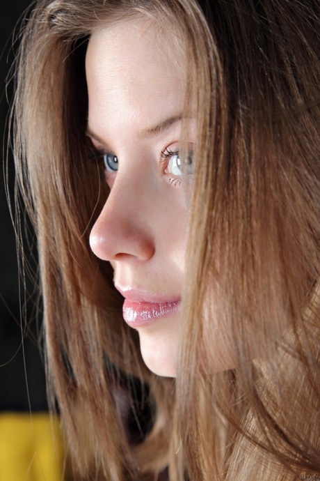 Cute teen with blue eyes Anita C flaunts her big juggs in a solo