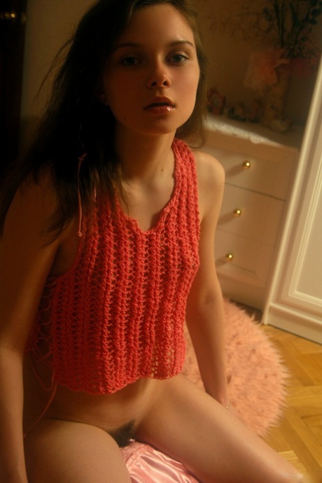 Shy teen babe Anna S displays her long pubic hair and small tits