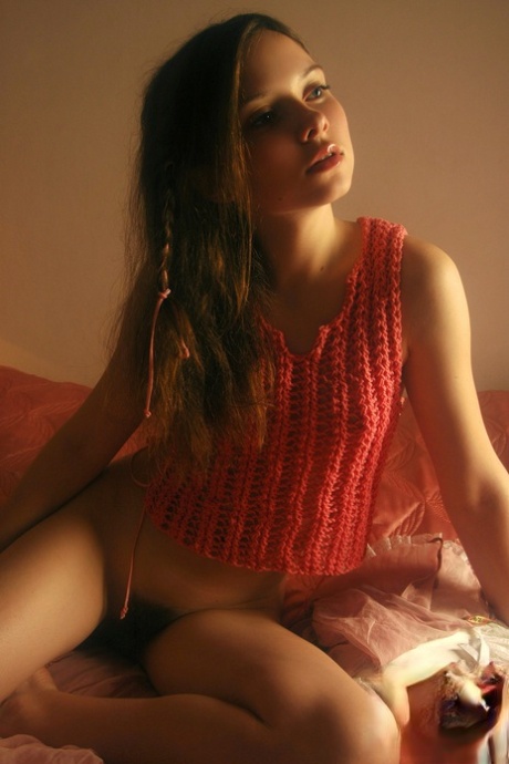 Shy teen babe Anna S displays her long pubic hair and small tits