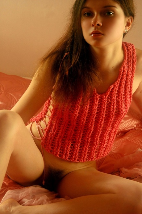 Shy teen babe Anna S displays her long pubic hair and small tits