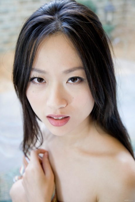 Charming Asian teen Willy HO shows her tiny tits and her hairy cunt