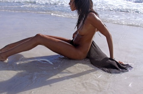 Exotic teen babe Danica A displaying her sexy tanned body & holes on the beach