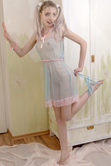 Cute babe Egida shows her petite body in a see-through dress & while naked