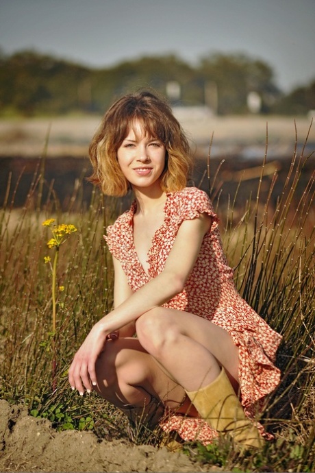Slim American babe Emily Windsor exposes her bushy twat outdoors