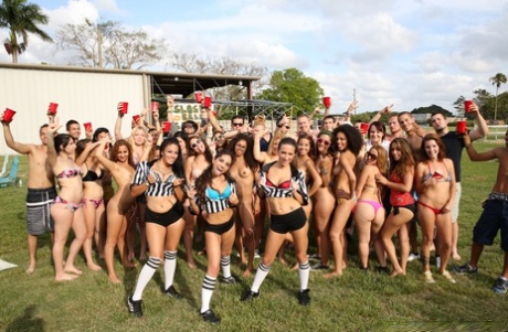 A bunch of sexy girls strip on the field and show off their incredible bodies