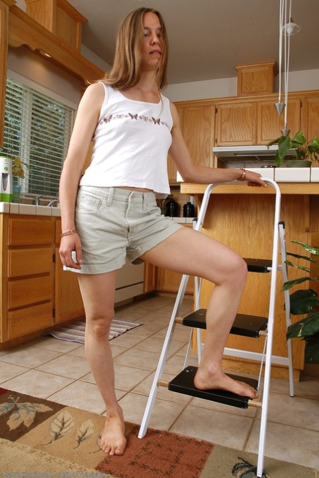 Young housewife Maddy plays with her super hairy pussy on the kitchen counter