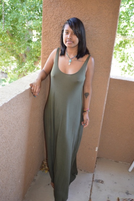 Ebony girl Diana Braset unveils her natural breasts & hairy cunt on a terrace