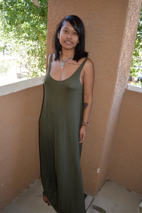 Ebony girl Diana Braset unveils her natural breasts & hairy cunt on a terrace