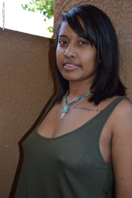 Ebony girl Diana Braset unveils her natural breasts & hairy cunt on a terrace