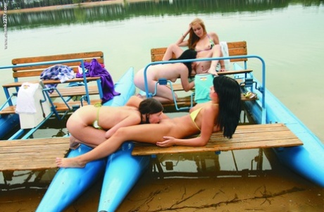 Slutty lesbian teens fingering, licking pussy & flaunting their bums on a boat