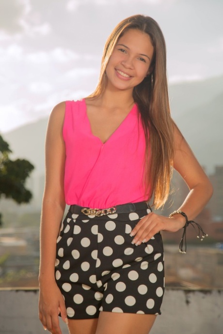 Teen Latina Kiara Lorens shows her slender body and flaunts her ass and twat