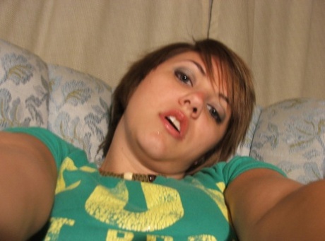 Beautiful short-haired amateur babe shows her big boobs in a solo