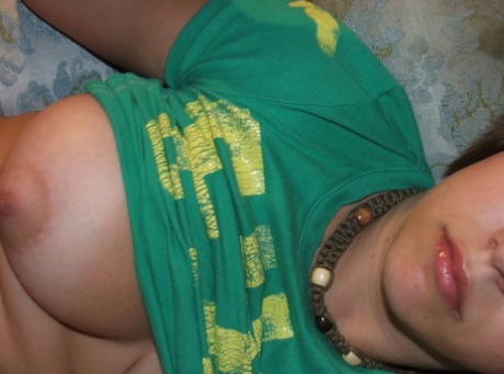Beautiful short-haired amateur babe shows her big boobs in a solo
