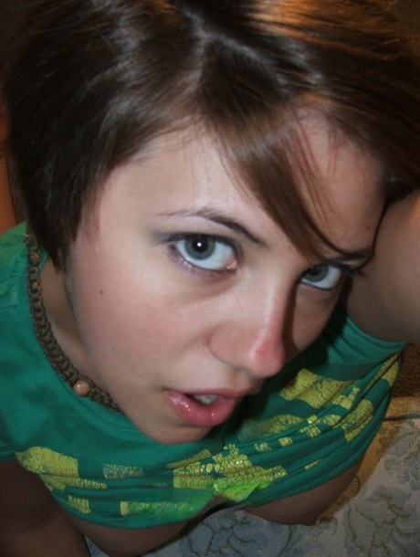 Beautiful short-haired amateur babe shows her big boobs in a solo