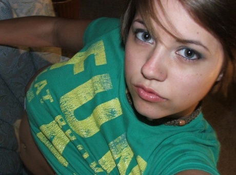 Beautiful short-haired amateur babe shows her big boobs in a solo