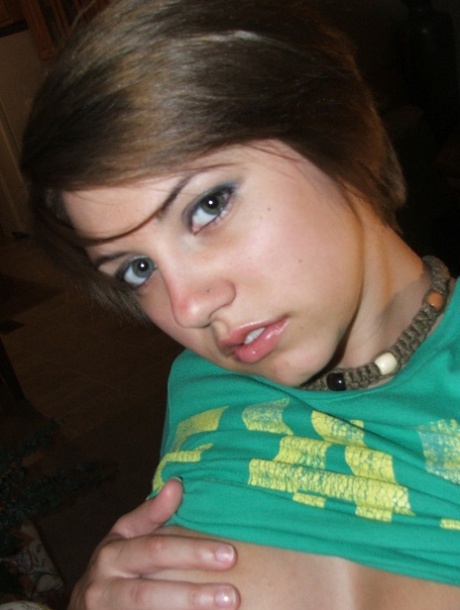 Beautiful short-haired amateur babe shows her big boobs in a solo