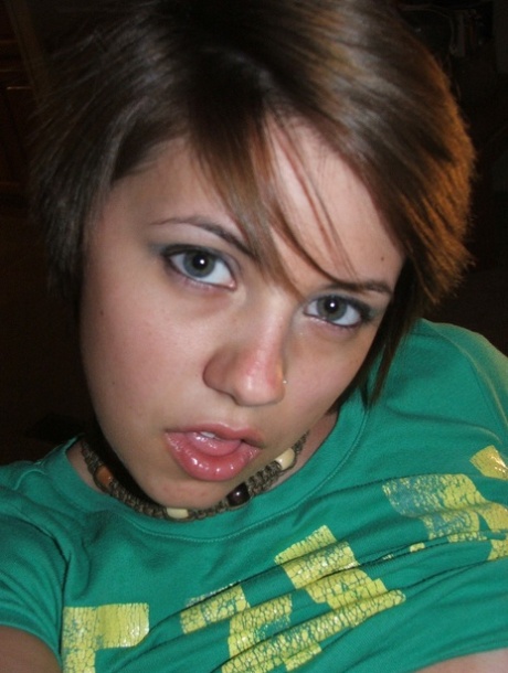 Beautiful short-haired amateur babe shows her big boobs in a solo