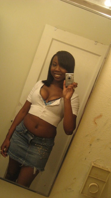 Amateur ebony teen Elisha strips and poses naked in front of the mirror