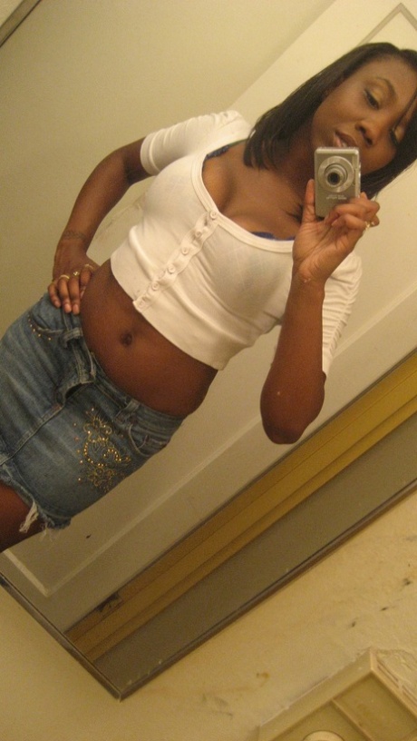 Amateur ebony teen Elisha strips and poses naked in front of the mirror