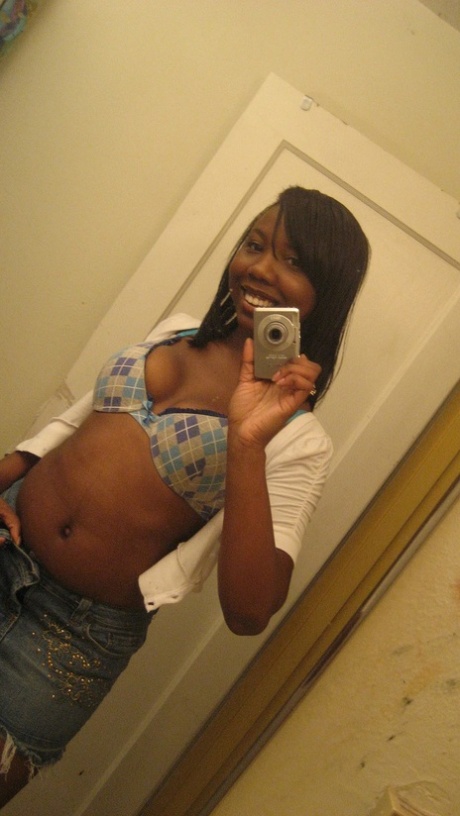 Amateur ebony teen Elisha strips and poses naked in front of the mirror