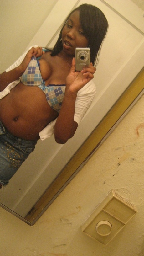 Amateur ebony teen Elisha strips and poses naked in front of the mirror