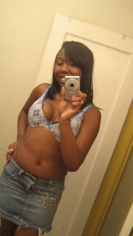 Amateur ebony teen Elisha strips and poses naked in front of the mirror