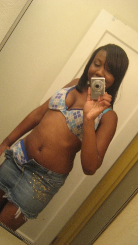Amateur ebony teen Elisha strips and poses naked in front of the mirror
