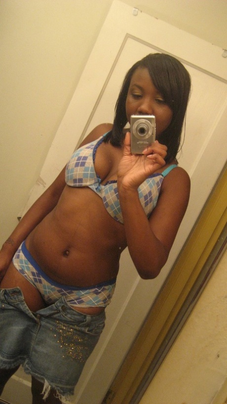 Amateur ebony teen Elisha strips and poses naked in front of the mirror